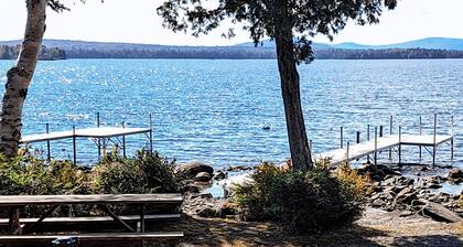 Lakefront home with private dock, mooring, pebble beach, grill, & firepit