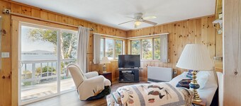 Lakefront home with private dock, mooring, pebble beach, grill, & firepit