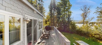 Lakefront home with private dock, mooring, pebble beach, grill, & firepit