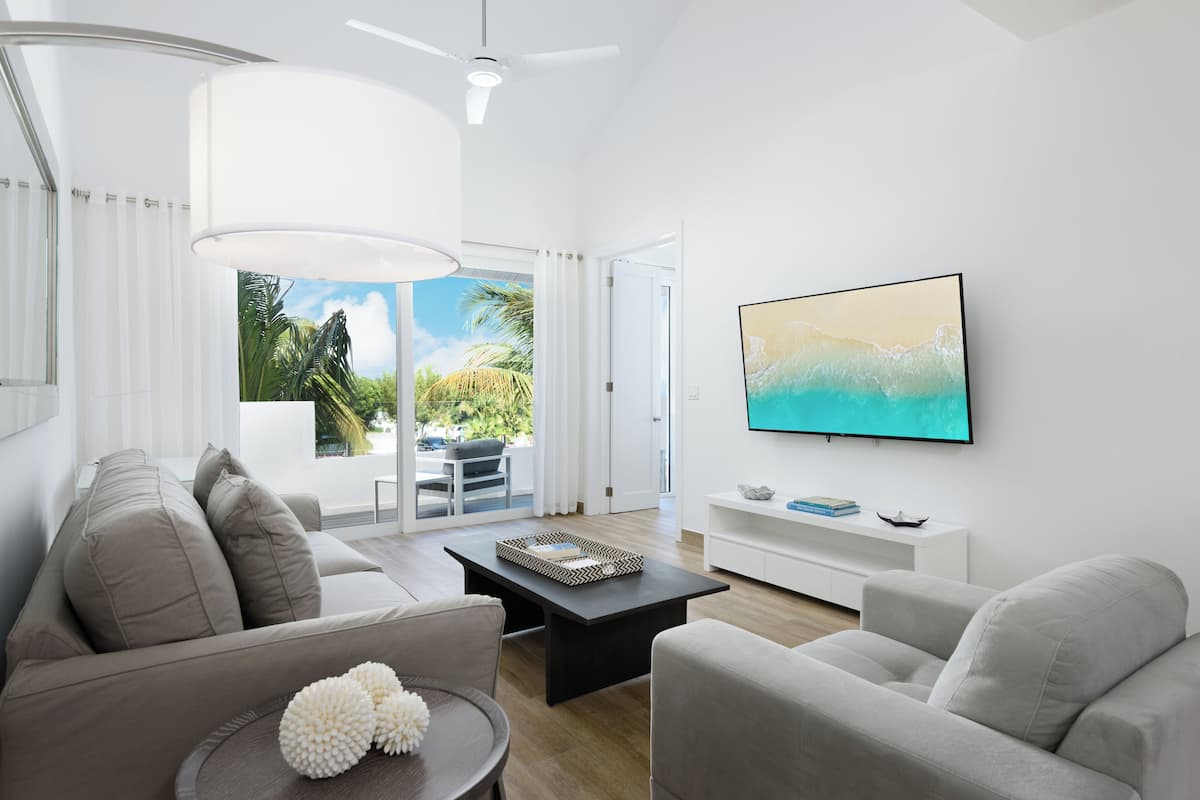 deluxe condo, 2 bedrooms, kitchen, marina view | living area | 70-inch smart tv with cable channels, tv