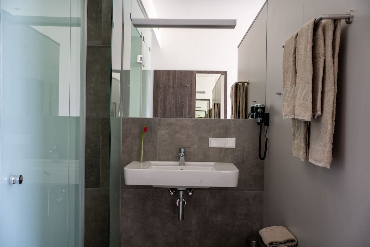 shower, hair dryer, heated floors, towels