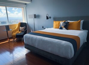 Suite estudio Deluxe | Caja de seguridad en la habitación y escritorio