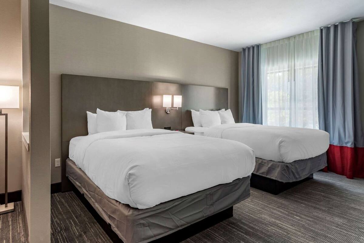 Premium bedding, desk, laptop workspace, soundproofing