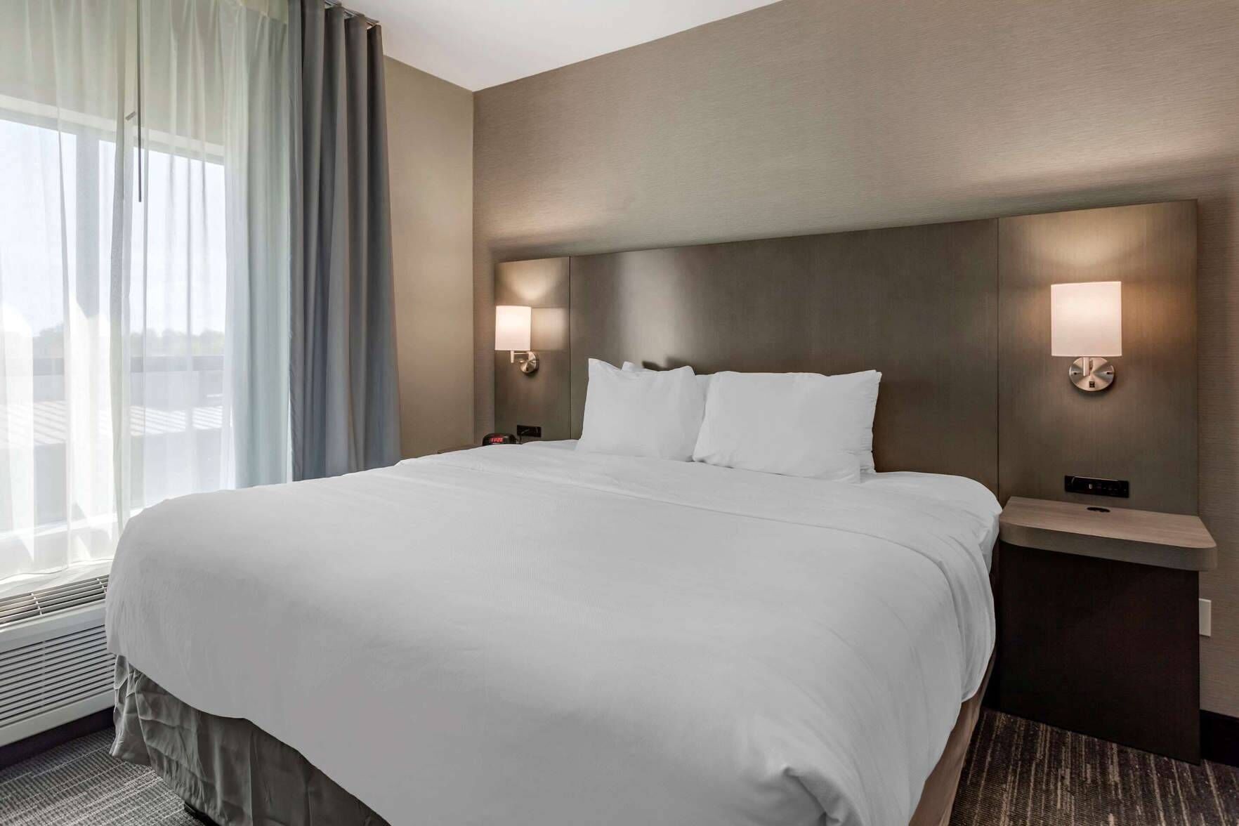 Premium bedding, desk, laptop workspace, soundproofing