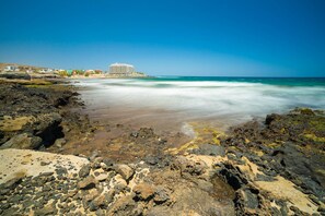On the beach, sun-loungers, beach towels