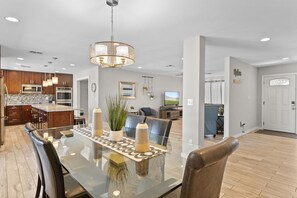 Enjoy a spacious living area with a dining table, modern kitchen and separate room.