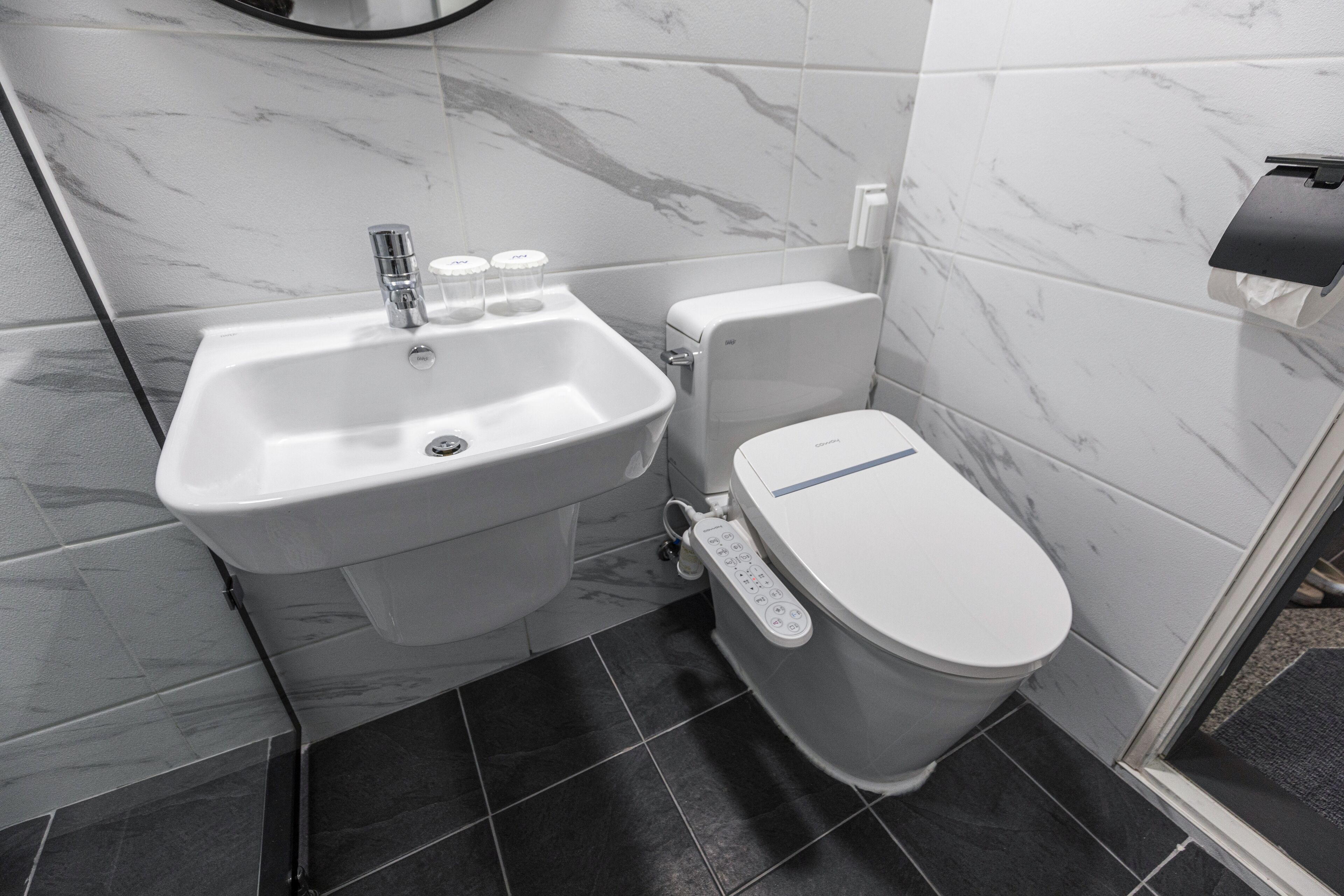 aewol - hotel type: deluxe twin room, ocean view | bathroom | hair dryer, bidet, towels, soap