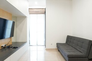 Room | Living room | TV - Wonderful and Cozy 2BR Apartment at Sudirman Suite (Jakarta)