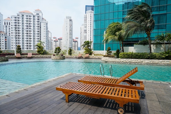 Outdoor pool - Modern 1BR Apartment at Central Park Residence (Jakarta)