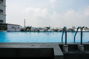 Outdoor pool - Chic and Cozy 2BR Apartment at Pasar Baru Mansion (Jakarta)