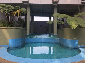 Outdoor pool - Modern 2BR Apartment at Grand Asia Afrika Residence (Bandung)