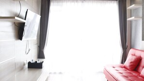 Room | Living room | TV - Bright & Stylish 2BR at Gateway Pasteur Apartment (Cimahi)