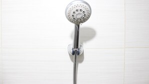 A showerhead mounted on a wall. - Artistic & Scenic Studio at Gateway Pasteur near Cimahi (Cimahi)