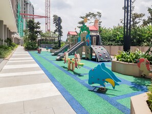 Children’s play area – outdoor - Comfortable 1BR Apartment at Marigold Nava Park (Pagedangan)