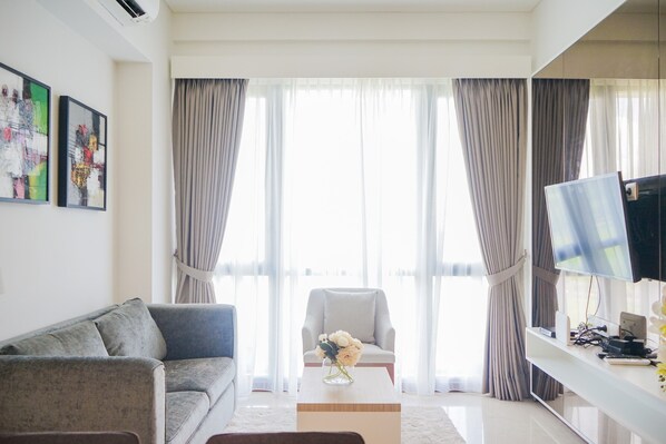 Living room - Comfortable 1BR Apartment at Marigold Nava Park (Pagedangan)
