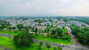 A residential area with houses, roads, and greenery.