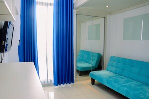 Room | Living room | TV - Minimalist and Posh Studio Dave Apartment (Depok)