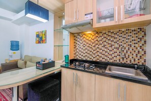 Room | Private kitchenette | Fridge, stovetop, cookware/dishes/utensils - Good Location 2BR Apartment Kalibata City near Mall (Jakarta)
