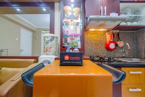 Room | Private kitchenette | Fridge, stovetop, cookware/dishes/utensils - Minimalist 2BR Apartment at Kalibata City near Shopping Center (Jakarta)