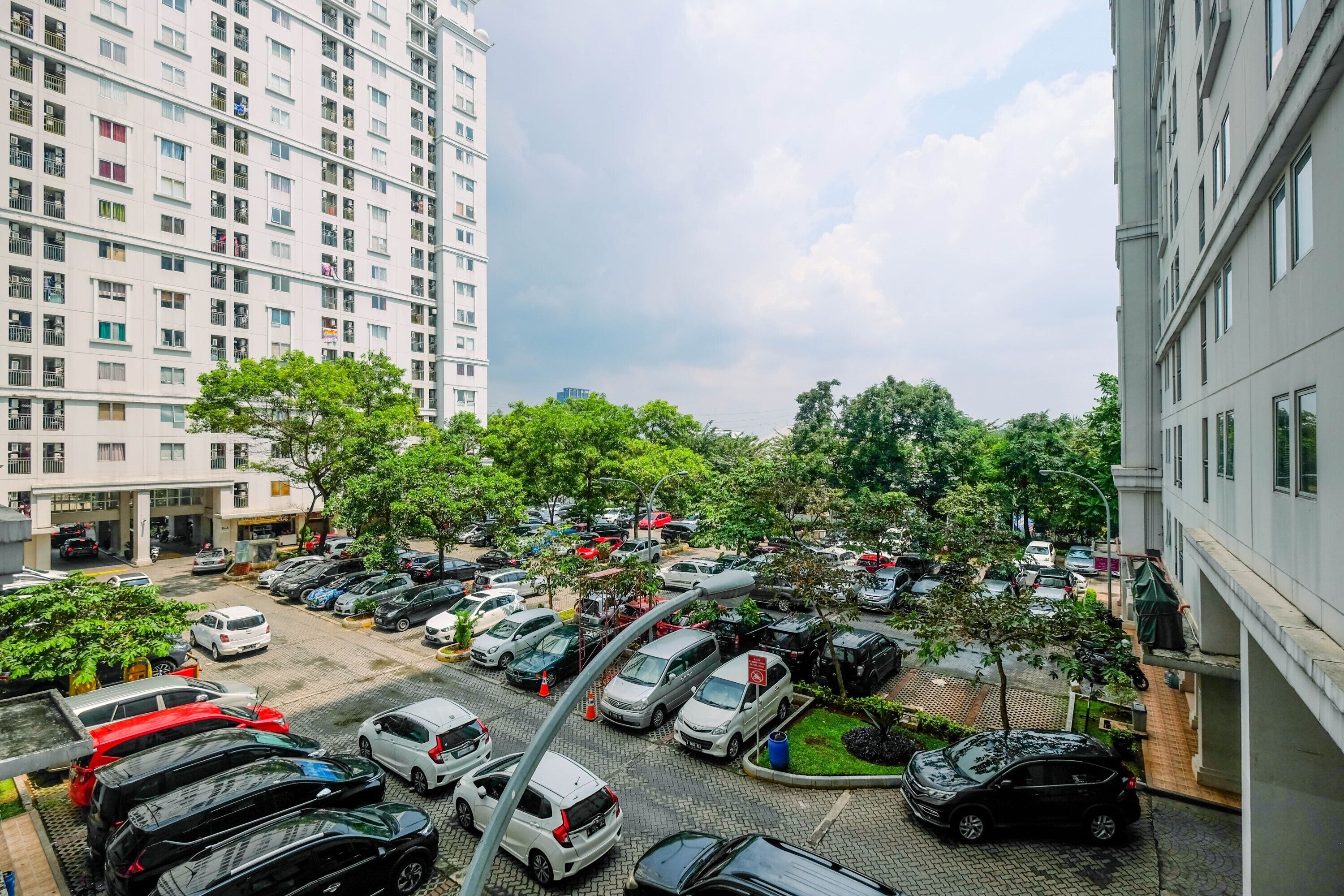 A multi-story parking garage with cars parked on multiple levels.