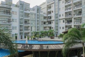 Outdoor pool - Great Location 2BR Pearl Garden Apartment (Jakarta)