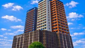 A multi-story building with a prominent 'KHILLS' sign on the lower facade. - K-Hills The Terrace (Paju)