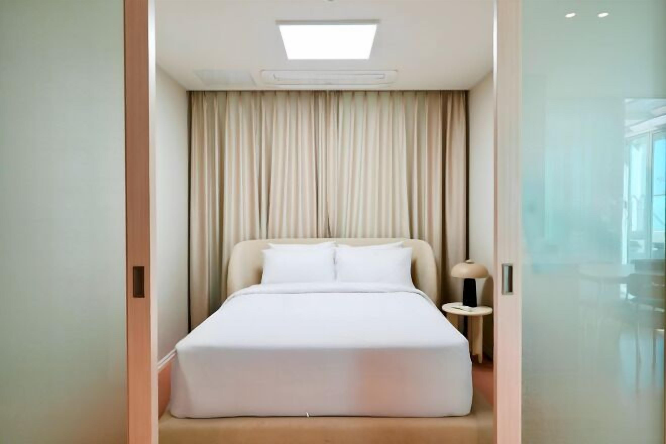 Desk, laptop workspace, blackout drapes, soundproofing