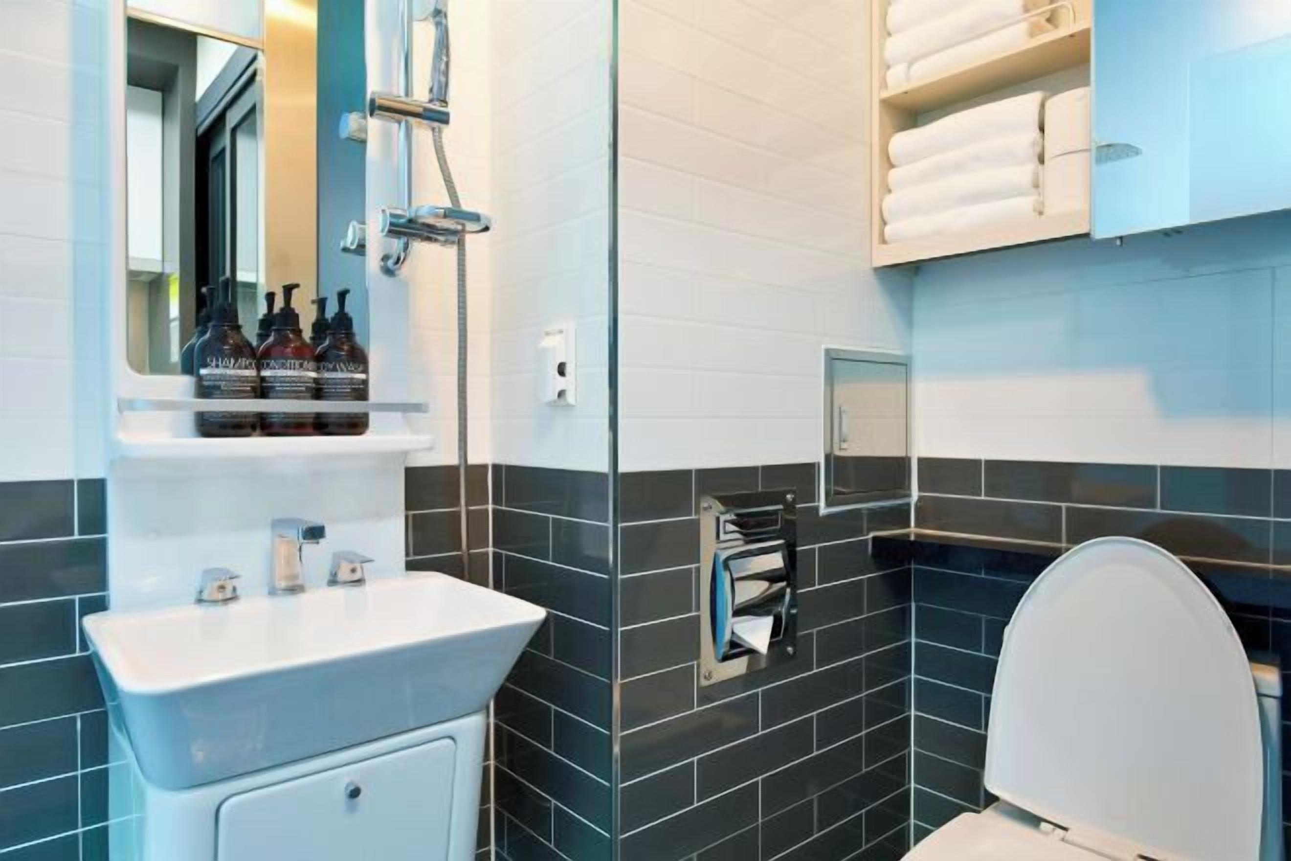 Bathroom | Shower, rainfall showerhead, hair dryer, slippers