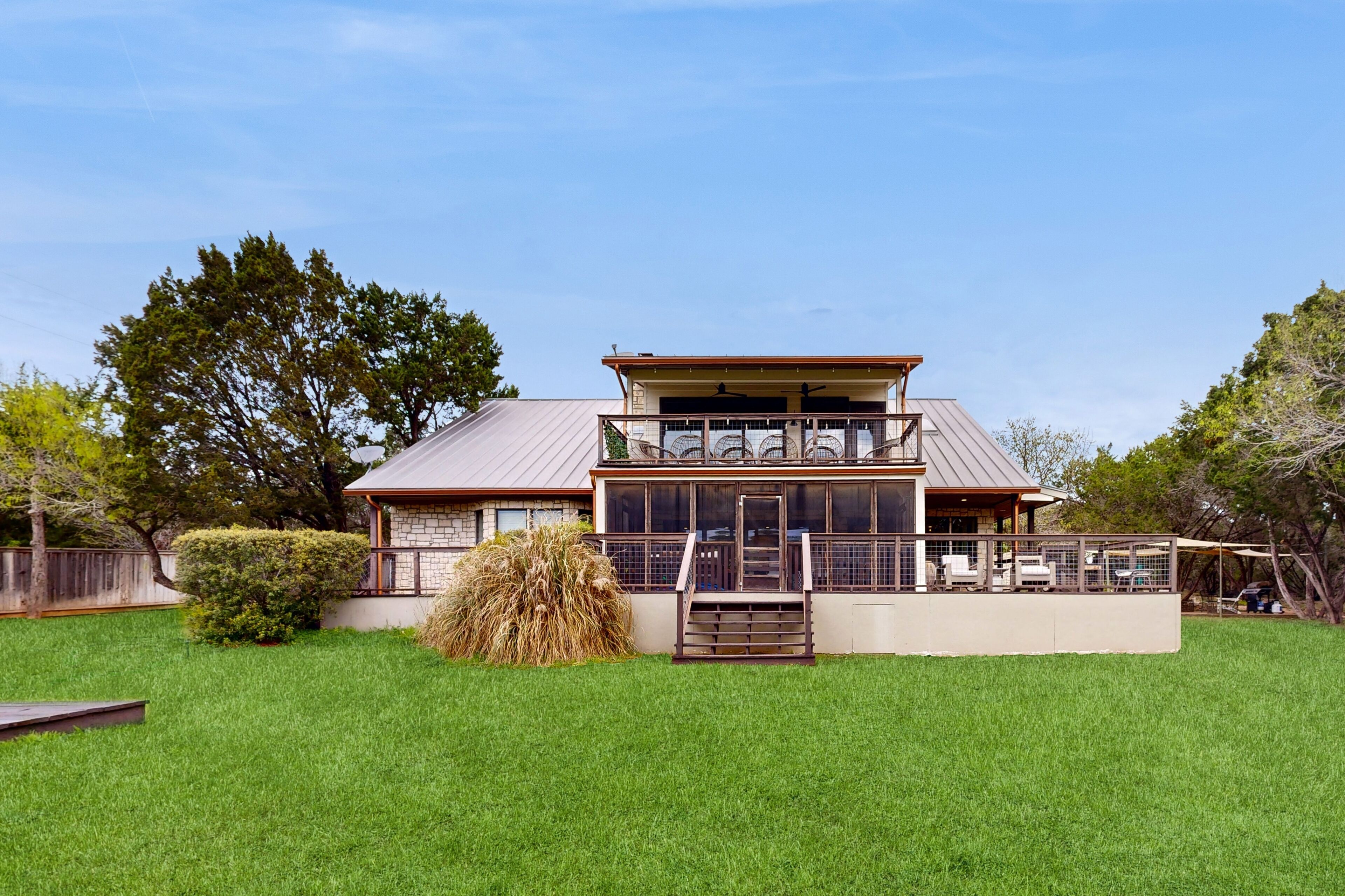 Dog-friendly riverfront home with hot tub & porch - condo above garage