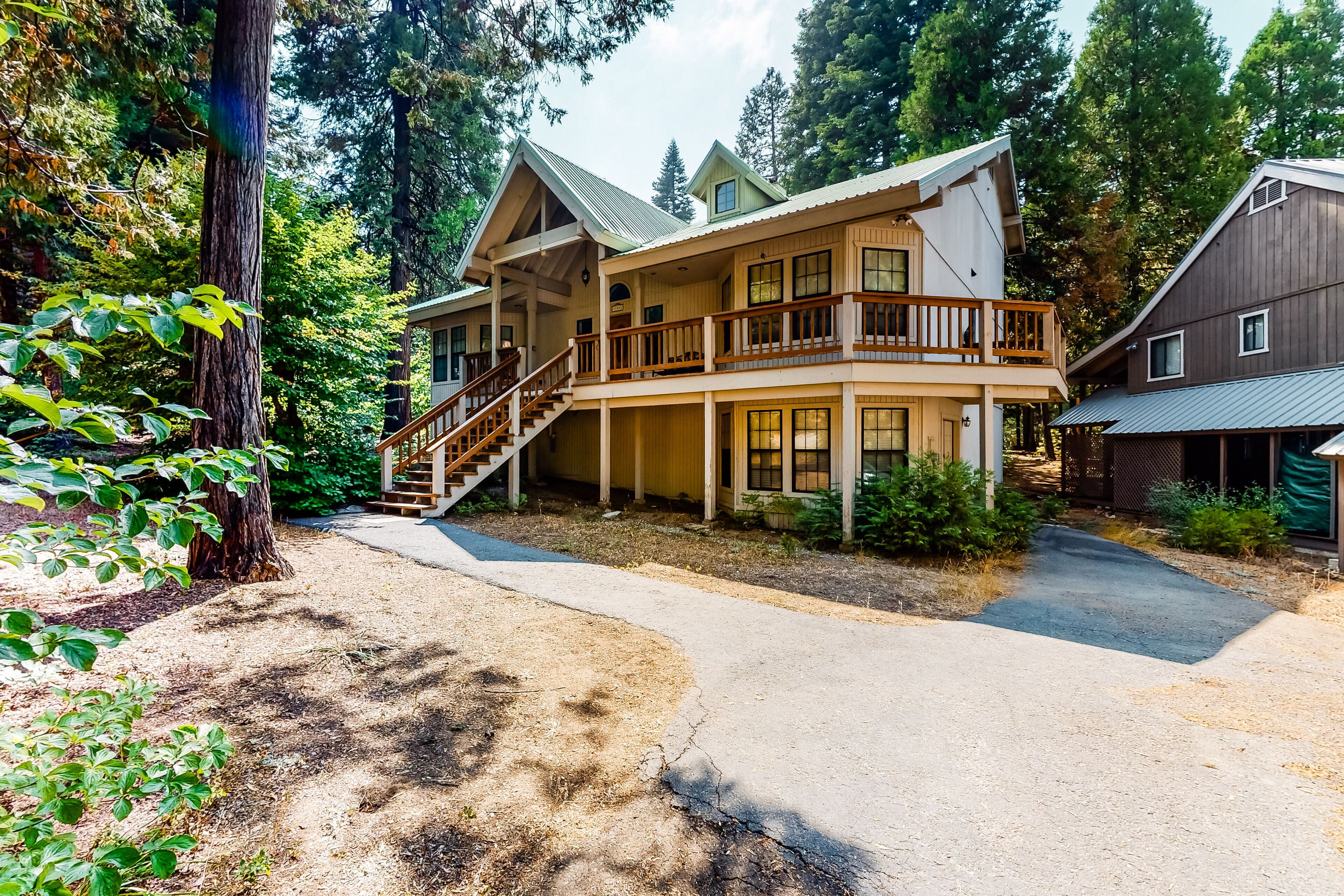 Welcoming home with private gas grill, multiple decks, & wood-burning fireplace