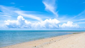 A beach with clear skies and calm waters.