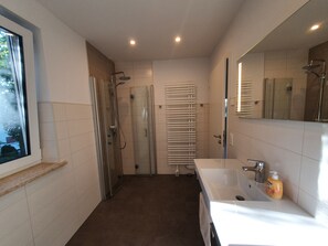 Shower, hair dryer, towels, soap