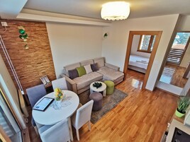 Superior Apartment | Living area | 32-inch LCD TV with cable channels, TV