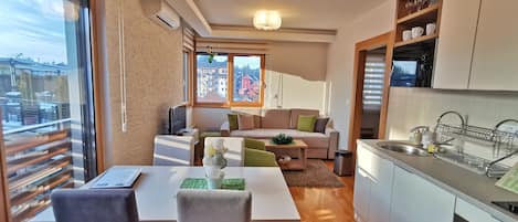 Superior Apartment | Living area | 32-inch LCD TV with cable channels, TV