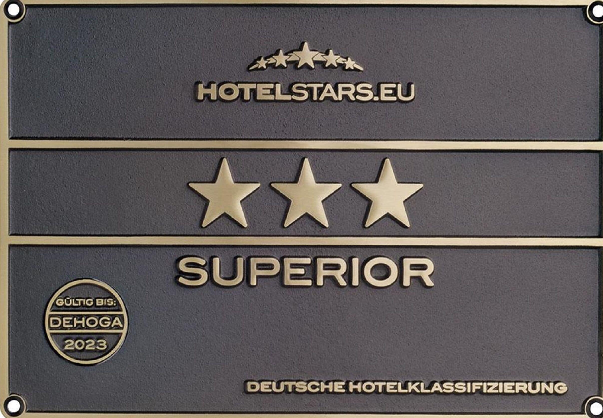 A plaque with the HotelStars.eu logo, three stars, and the word "SUPERIOR".