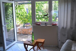 Apartment, 1 Bedroom, Balcony | Living area | 20-inch TV with satellite channels