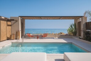 A pool with a view of the sea, outdoor seating, and a pergola. - Iris Beachfront Residence, Coastal City Living (Rethimno)