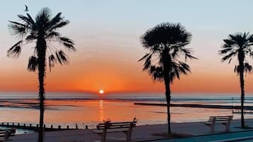 On the beach, sun loungers, beach towels