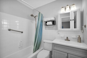 Combined shower/tub, hair dryer, towels, soap