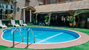 Outdoor pool, pool umbrellas, pool loungers