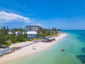 Beach nearby, white sand, beach towels