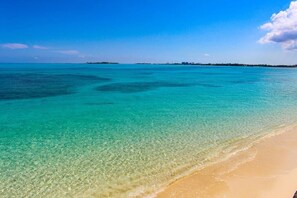 Beach nearby, white sand, beach towels