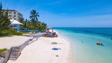 Beach nearby, white sand, beach towels
