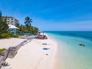 Beach nearby, white sand, beach towels