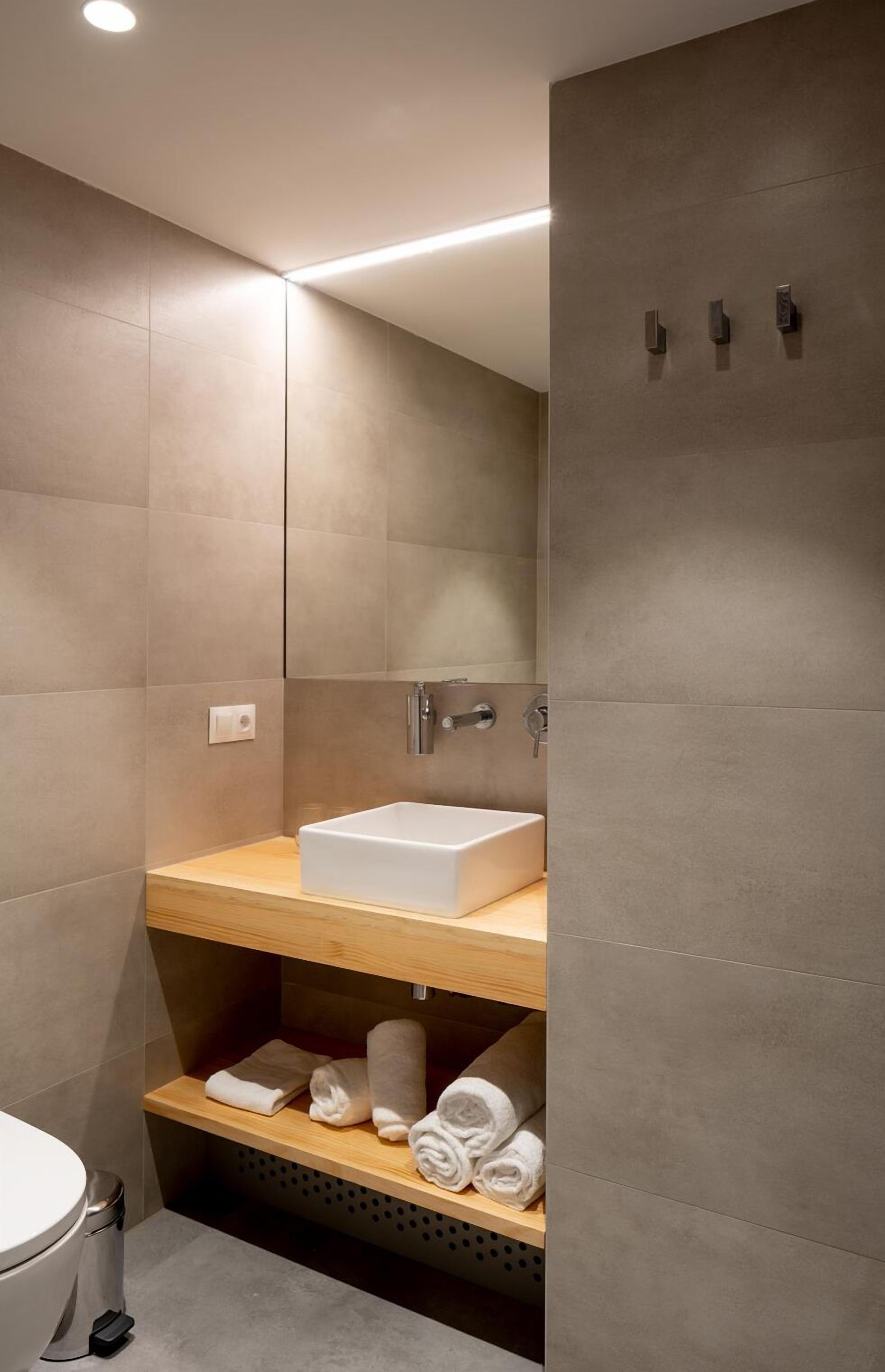 double room, courtyard view | bathroom | shower, rainfall showerhead, towels, soap