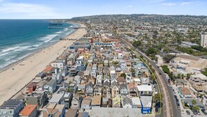 A coastal cityscape with a beach, dense residential area, and a pier named Crystal Pier. - Modern beach home only 8 houses from the beach. Check out our new drone video!! (San Diego)