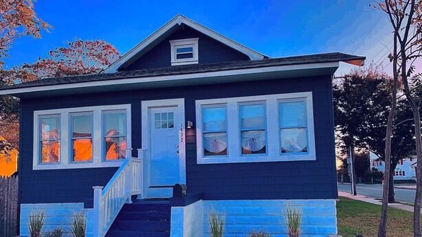 A two-story house with a blue exterior, white trim, and a front porch with steps. - BEST⭐️6 SLEEPS+|3 BDR ENTIRE HOME💖FREE PARKING#Pet Friendly|Near Beaches CASINO (Atlantic City)