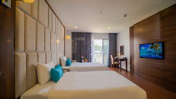 A modern hotel room with two beds, a TV, a balcony with a view, and a desk.