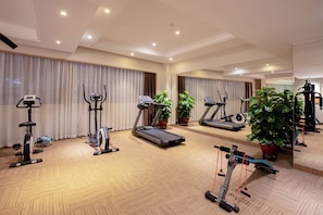 Stay active with our well-equipped fitness room featuring a treadmill, elliptical trainer, stationary bike, and resistance bands.