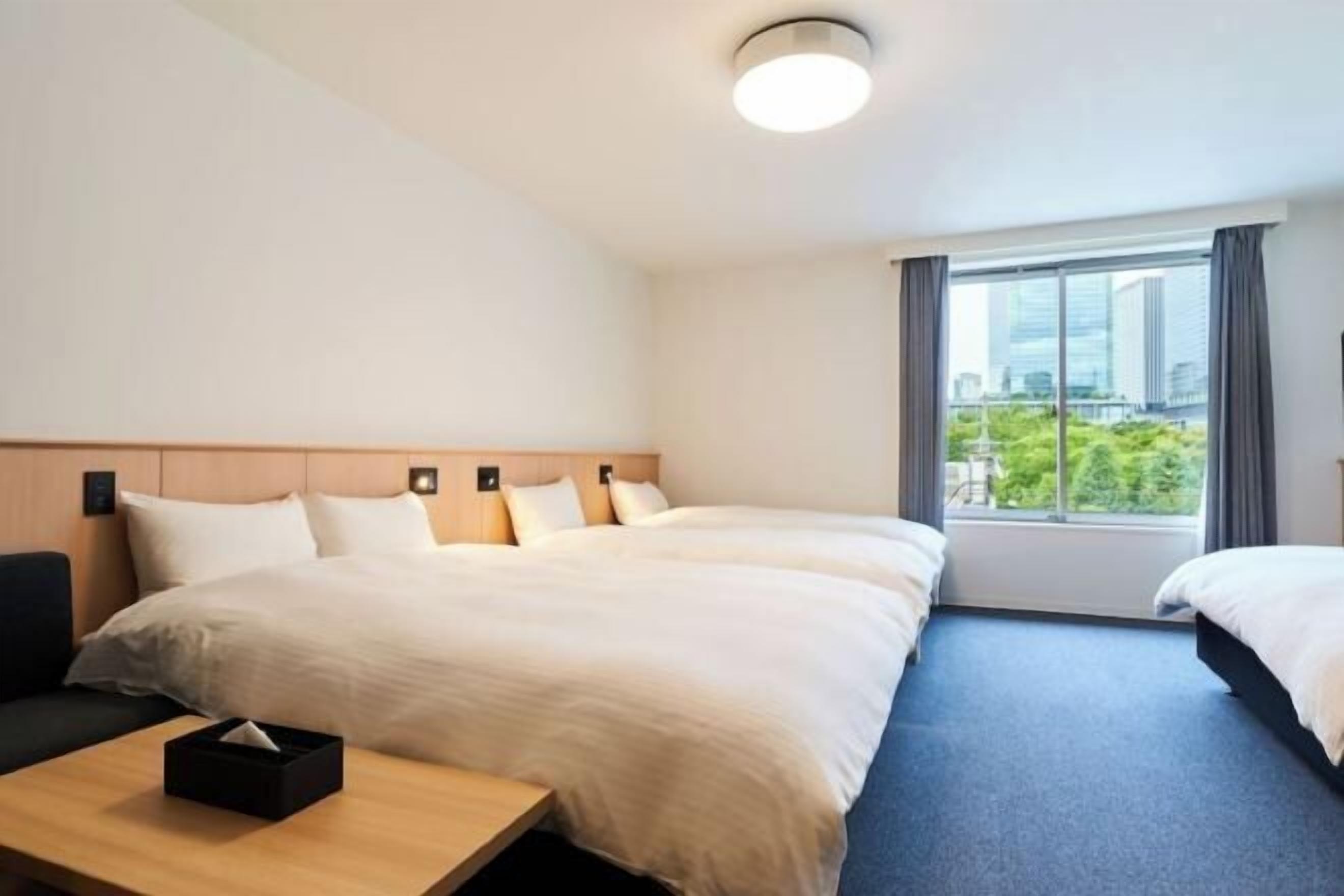 Premium bedding, desk, laptop workspace, blackout curtains